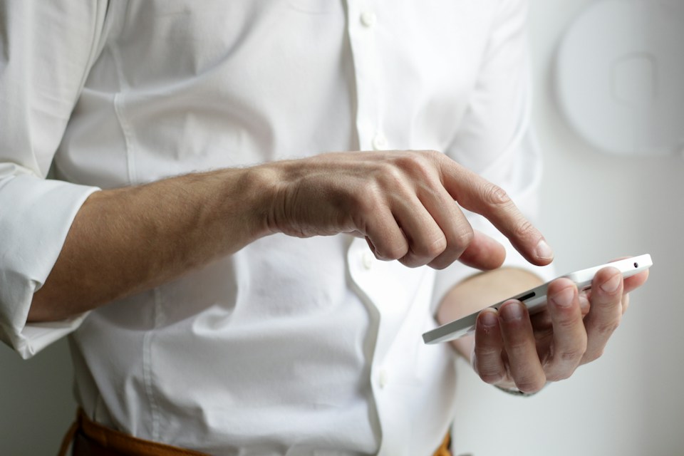 A person using a smartphone to connect